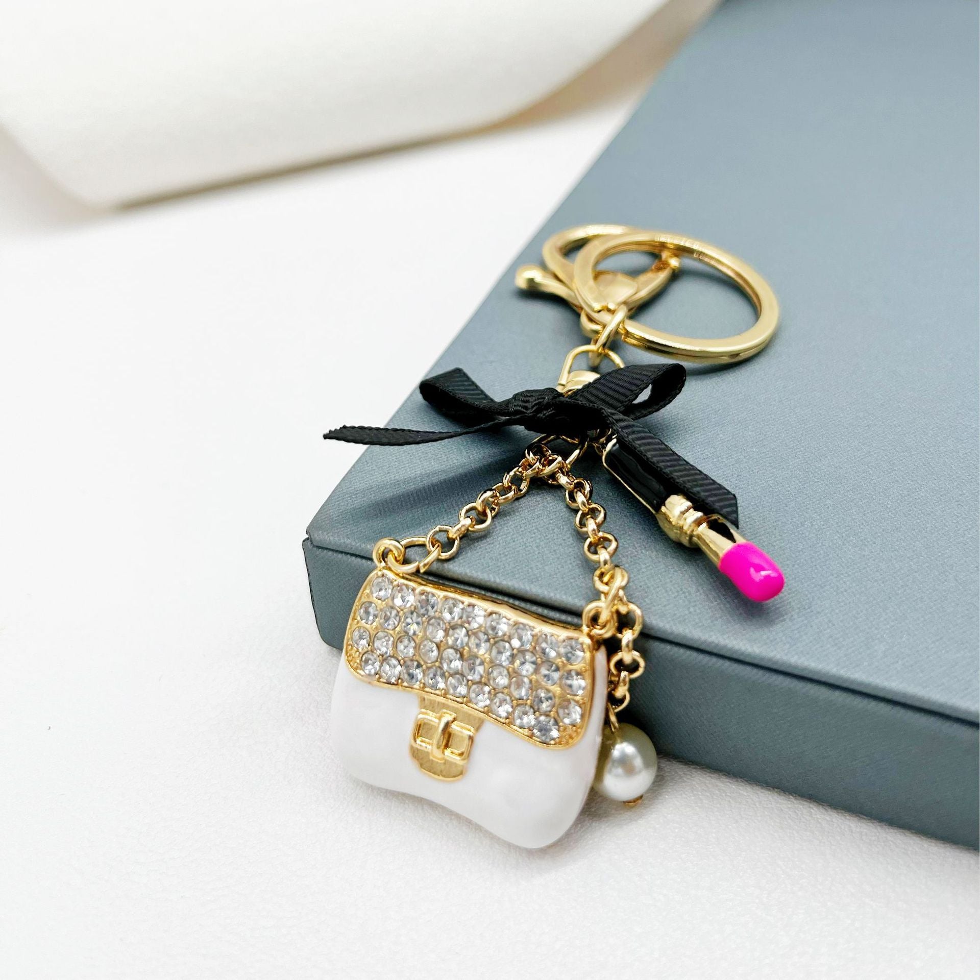 Wholesale Rhinestone Lipstick Bow Small Shoulder Bag Alloy Keychain